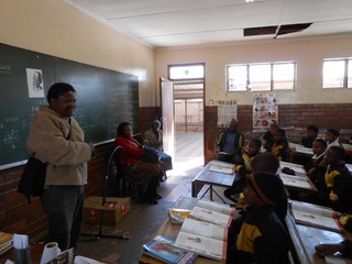 Professor Thebe Medupe addressing learners at a school in Mafikeng