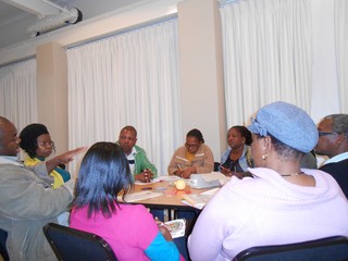 Educators discussing curriculum material