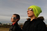 Two boys watch the solar eclipse in Iceland